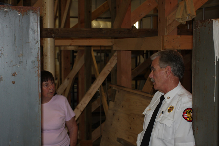 Chief Parow talks with Peggy Dunn about temporary repairs at the open house, August 12, 2009