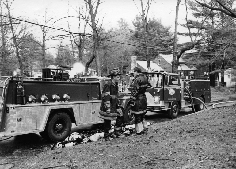 The 1970 Ford/Farrar Forest Fire Truck, Engine 6 on the left,
	was converted to a rescue truck by themen of the department