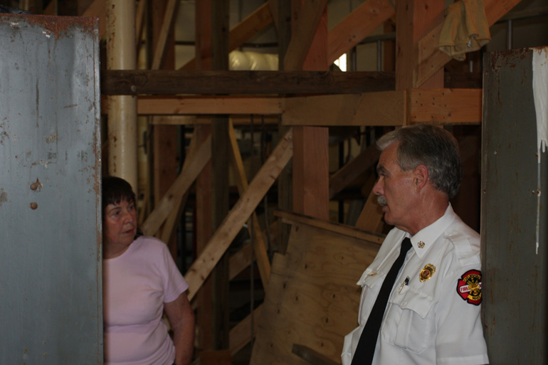 Chief Parow talks with Peggy Dunn about temporary repairs at the open house, August 12, 2009