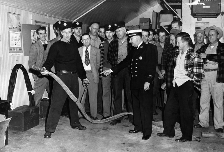 Interior of the old Center Fire Station in 1950, class of instruction
with Lowell District Captain John Thomas